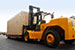 Fork lifting vehicles transferring cargo