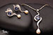 Delicate diamond, pearl and blue sapphire pendent & earring collection