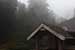 travel photography_hill side country tiled house in mist